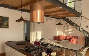 a kitchen with a table and a stove in a room at Poggio Madonna in Campagnatico