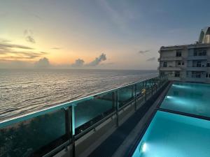 a view of the ocean from the balcony of a cruise ship at 43 By The Sea in Dehiwala