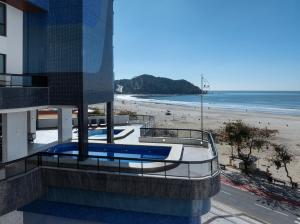 a view of a beach from a building at Hotel D'sintra in Balneário Camboriú
