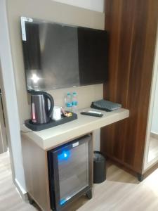 a desk in a room with a computer on it at Sama Al Sweifieh - سما الصويفية in Amman