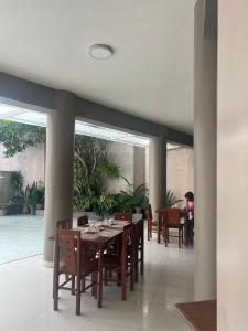 a dining room with a table and chairs at Gran Marañon Hotel in Iquitos