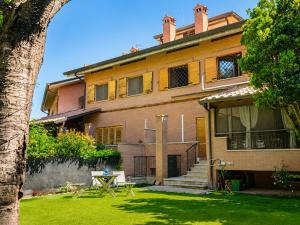 a large house with a table in front of it at Villa Domus Roma in Rome