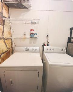 a kitchen with a white stove and a dishwasher at Bankston House B&C in Marietta