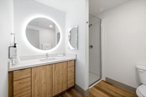 a bathroom with a sink and a mirror at The 233 Suites Unscripted By Hyatt in Mesa +10 photos
