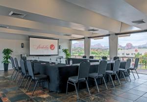 a conference room with a long table and chairs at Arabella Hotel Sedona in Sedona +52 photos