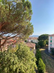 a view of a city from a tree at Perla Blu House in La Spezia