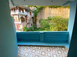 a view from the balcony of a room with a window at Sadyal Hotel And Restaurant in Tīra Sujānpur