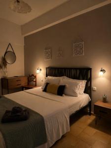 a bedroom with a large bed with white pillows at Kokkala Guestrooms in Kokkala +33 photos