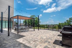 a patio with a gazebo and a grill at Staybridge Suites Crestview South by IHG in Crestview