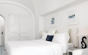 A bed or beds in a room at Hotel La Minerva
