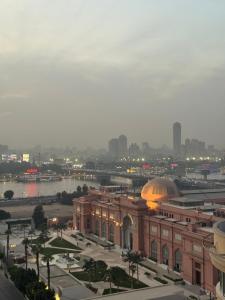 a view of a city with a large building at Cleopatra Hotel in Cairo