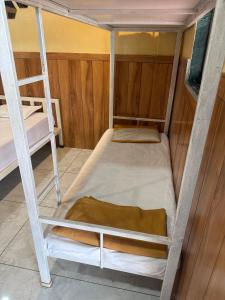 a couple of bunk beds in a room at Green Fog Guesthouse in Lonavala