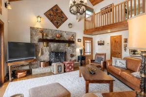 a living room with a couch and a fireplace at Ultimate Lake Norris Getaway with Private Dock in New Tazewell +11 photos
