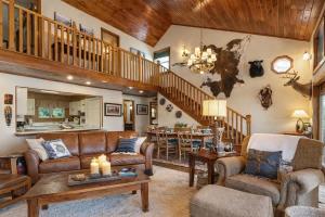 a living room with a couch and a table at Ultimate Lake Norris Getaway with Private Dock in New Tazewell