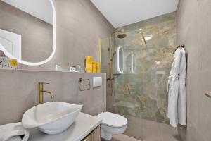 a bathroom with a sink and a toilet and a shower at B&B Villa Dubrovnik Garden in Dubrovnik +71 photos