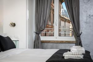 A bed or beds in a room at Brunelleschi Holidays Hostel