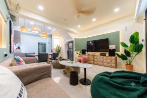 a living room with a couch and a table at 原森民宿B&b包棟最佳選擇 in Wujie