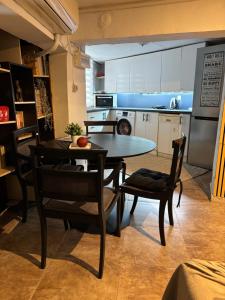 a kitchen and dining room with a table and chairs at Alfeios cozy stays - Rustic 