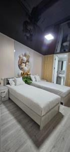 a bedroom with two beds in a room at 10 USD New Hotel in Tashkent