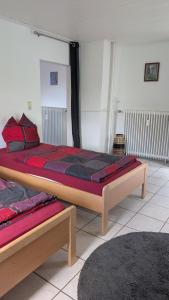 a bedroom with two beds in a room at Waldesruh in Pirmasens
