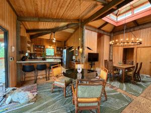 a living room with a dog laying on the floor at Tiki Treehouse in Keaau