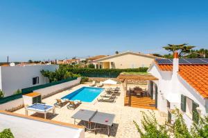 an image of a swimming pool in a house at Villa Ingrid Porter by Villa Plus in Cala en Porter