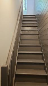 a stairway in a building with a stair case at Maison de ville in Roquemaure +2 photos