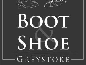 a sign that saysoit shoe workshop with shoes at The Boot and Shoe in Greystoke +1 photo