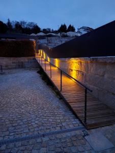 a staircase with lights on the side of a building at Refúgio D'Aguiar in Aguiar da Beira +11 photos