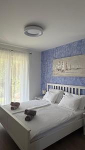 a bedroom with a large bed with towels on it at Villa Paula Jakišnica with heated pool in Lun +32 photos