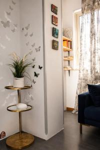 a living room with butterflies on the wall at Archivio 32 in Caserta
