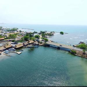 an aerial view of a river with boats and a bridge at Cabañas Calipso # 7 in Coveñas