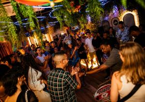 a crowd of people dancing at a party at Ipanema Beach Hostel in Rio de Janeiro