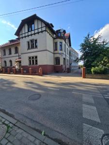 a building on the side of a street at Willa Carcassonne in Paczków