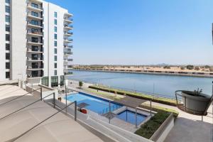 a view of a body of water from a building at Waterfront Yas 1BR near F1 & Ticket Savings in Abu Dhabi