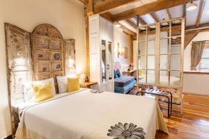 a bedroom with a large bed in a room at The Secret Garden in Quito +201 photos