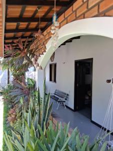 a porch of a house with a patio at Garden House - Atins in Atins