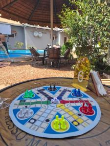 a table with a board game on top of it at Ursa lodge in Lubumbashi