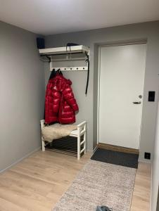 a room with a closet with a bed and a door at The Eikorn House in Skien