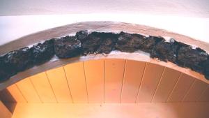 an opening in a ceiling with a pile of dirt at Chibedda Dimora Lia in Acitrezza