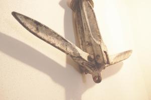 a peeled up banana hanging on a wall at Chibedda Dimora Lia in Acitrezza