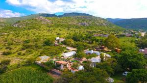 an aerial view of a house on a hill at Lovely garden flat with stunning mountain views in Alcocer
