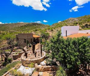 an aerial view of a house with a mountain at Lovely garden flat with stunning mountain views in Alcocer