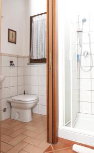 a bathroom with a toilet and a shower at Agri Village Pavia in Certosa di Pavia