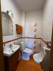 a bathroom with a toilet and a sink at Just Chill in Riga +16 photos