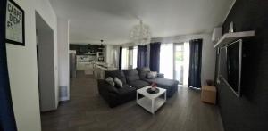 a living room with a couch and a table at LaLuna House in Cernik