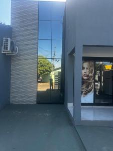 a building with a window with a picture of a woman at Florence Nightingale in Sorriso