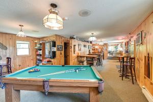 a pool table in a room with wooden walls at Dock, Direct Waterfront: Lake Champlain Studio in Willsboro