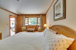 a bedroom with a large bed and a desk at Lakeside Fun! Willsboro Studio w/ Dock + Fire Pit in Willsboro