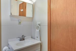 a bathroom with a sink and a mirror at Lake Champlain On-Site! Waterfront Studio w/ Dock in Willsboro +35 photos